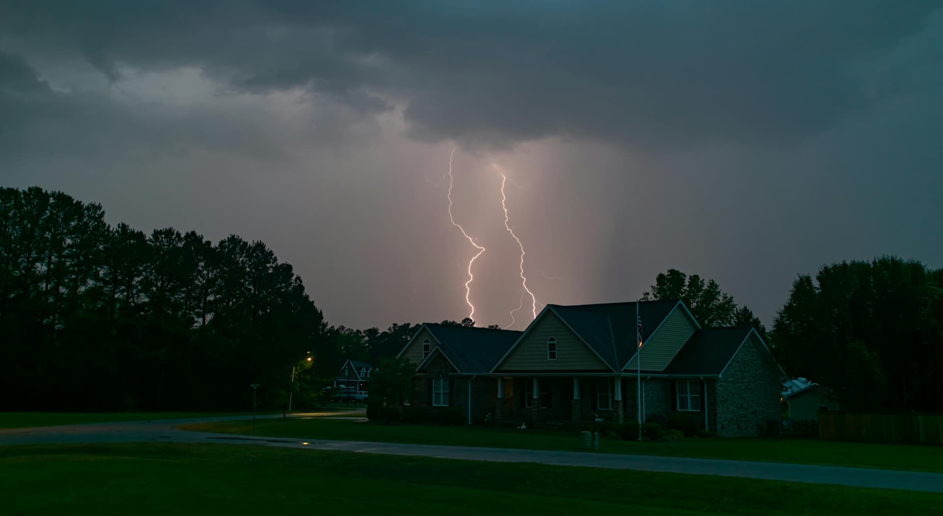 Lightning over a Central Florida suburban neighborhood at night